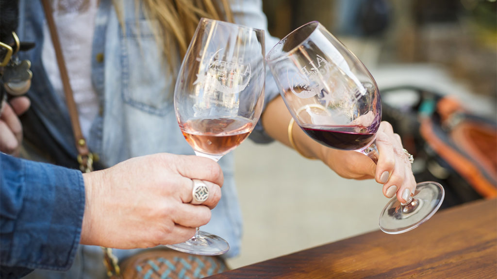 Attendees doing a 'cheers' at Alpen Wine Fest in Lake Tahoe.