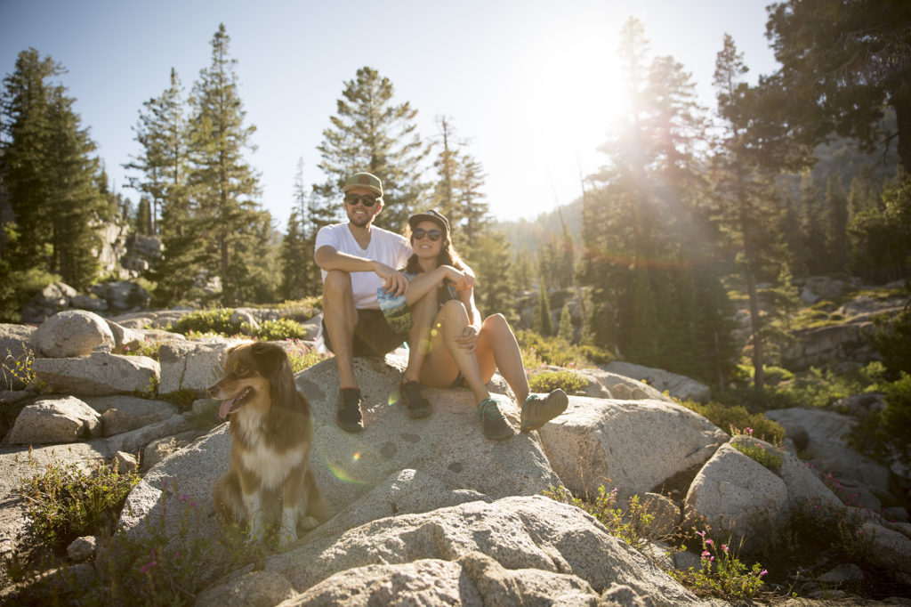 Couple and their dog take a break during a hike on the Shirley Canyon Trail at Squaw Valley