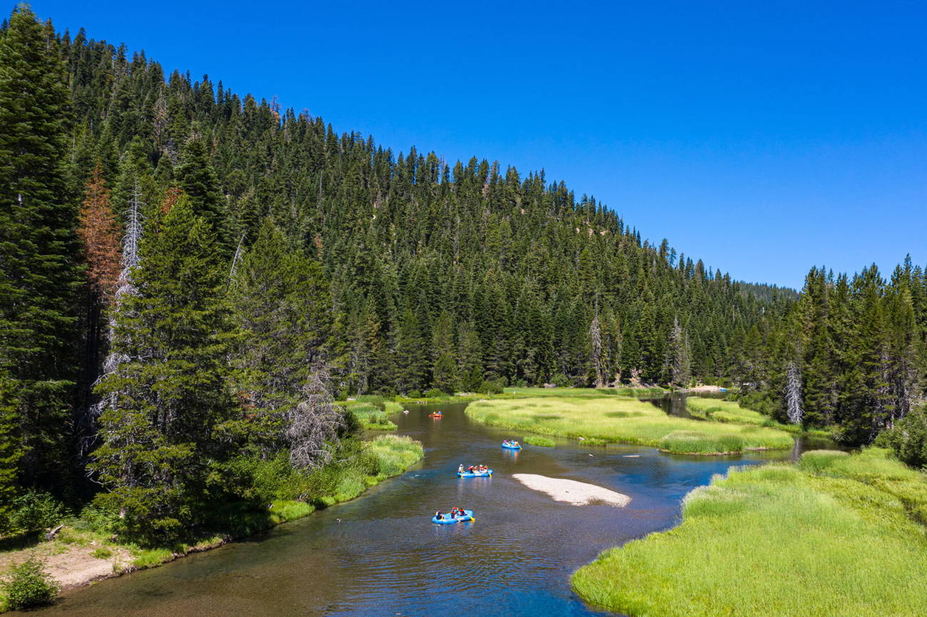 People rafting down the Truckee River from Tahoe City to the River Ranch at the base of Alpine Meadows