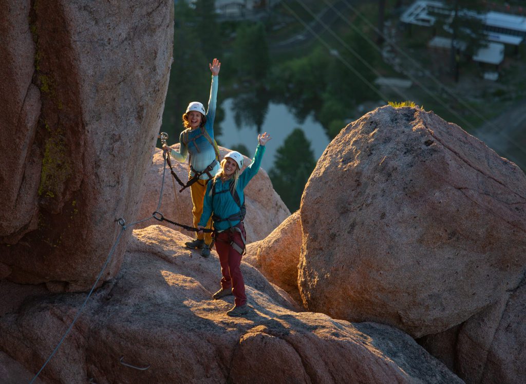 Two women climbing the Via Ferrata on Squaw Valley's Tram Face
