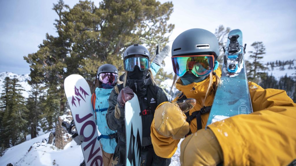 Three women enjoy new snow at Alpine Meadows.