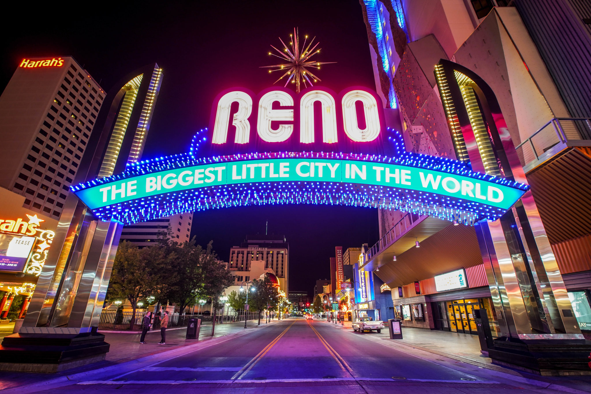 Reno's iconic sign at night that reads "The Biggest Little City in the World"