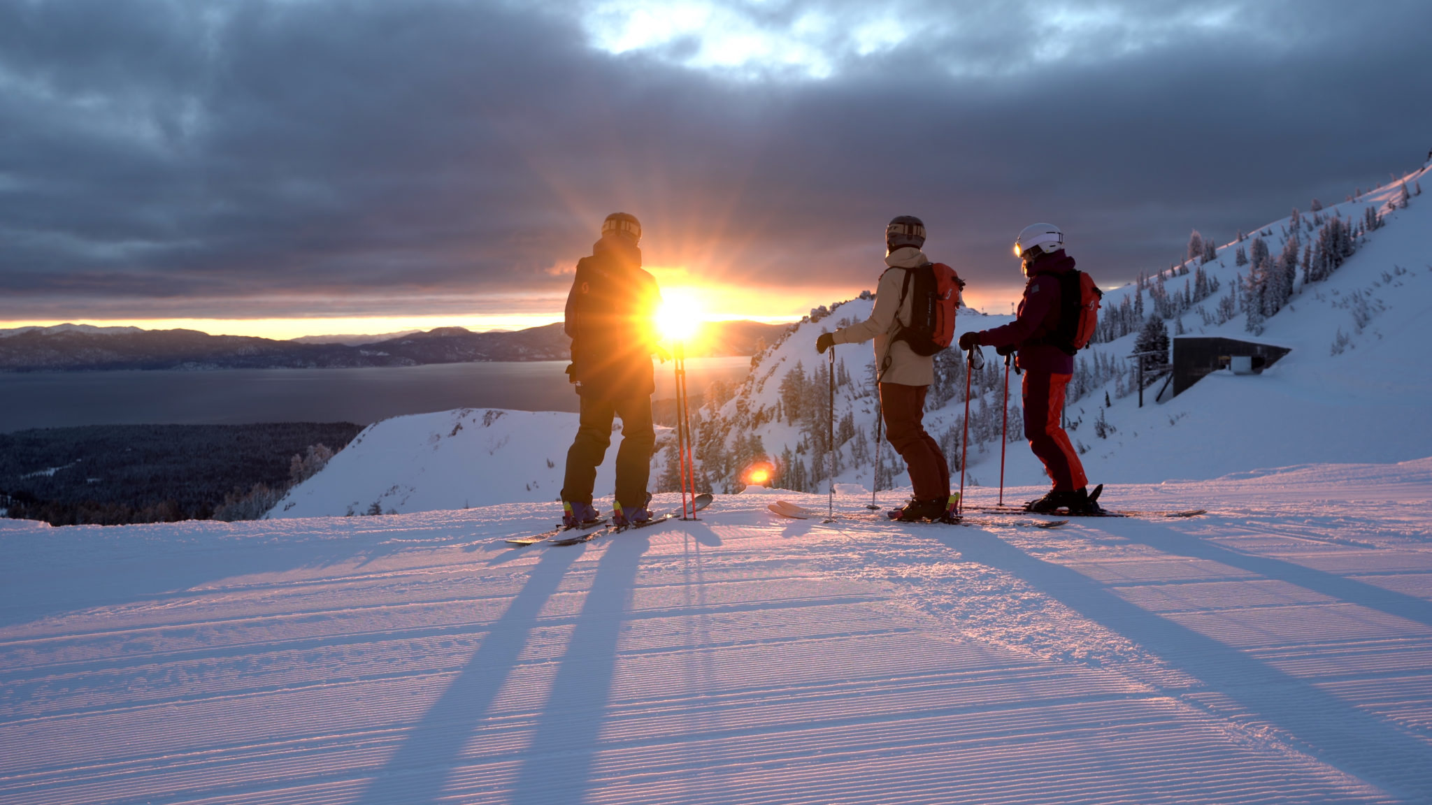 Skiers at the top of Summit Chair at Alpine Meadows at sunrise