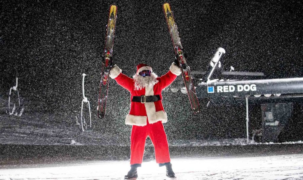 Santa in front of Red Dog at Palisades Tahoe.