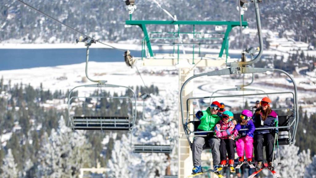 A family on a chairlift at Big Bear Mountain Resort. 