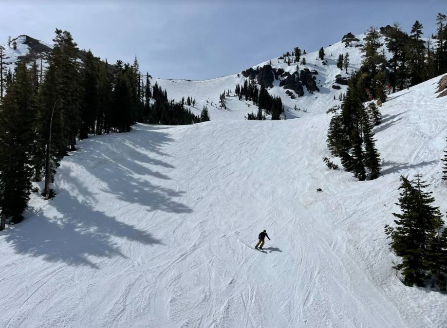 Skiers on a soft groomer at Palisades.