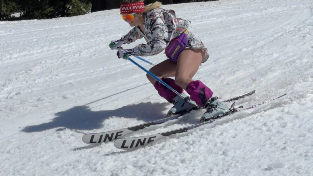 Skier in shorts at Palisades Tahoe during spring season