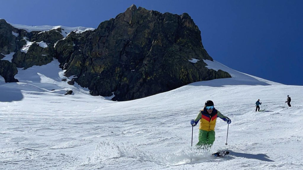 Skier in soft corn snow on Siberia Face at Palisades Tahoe
