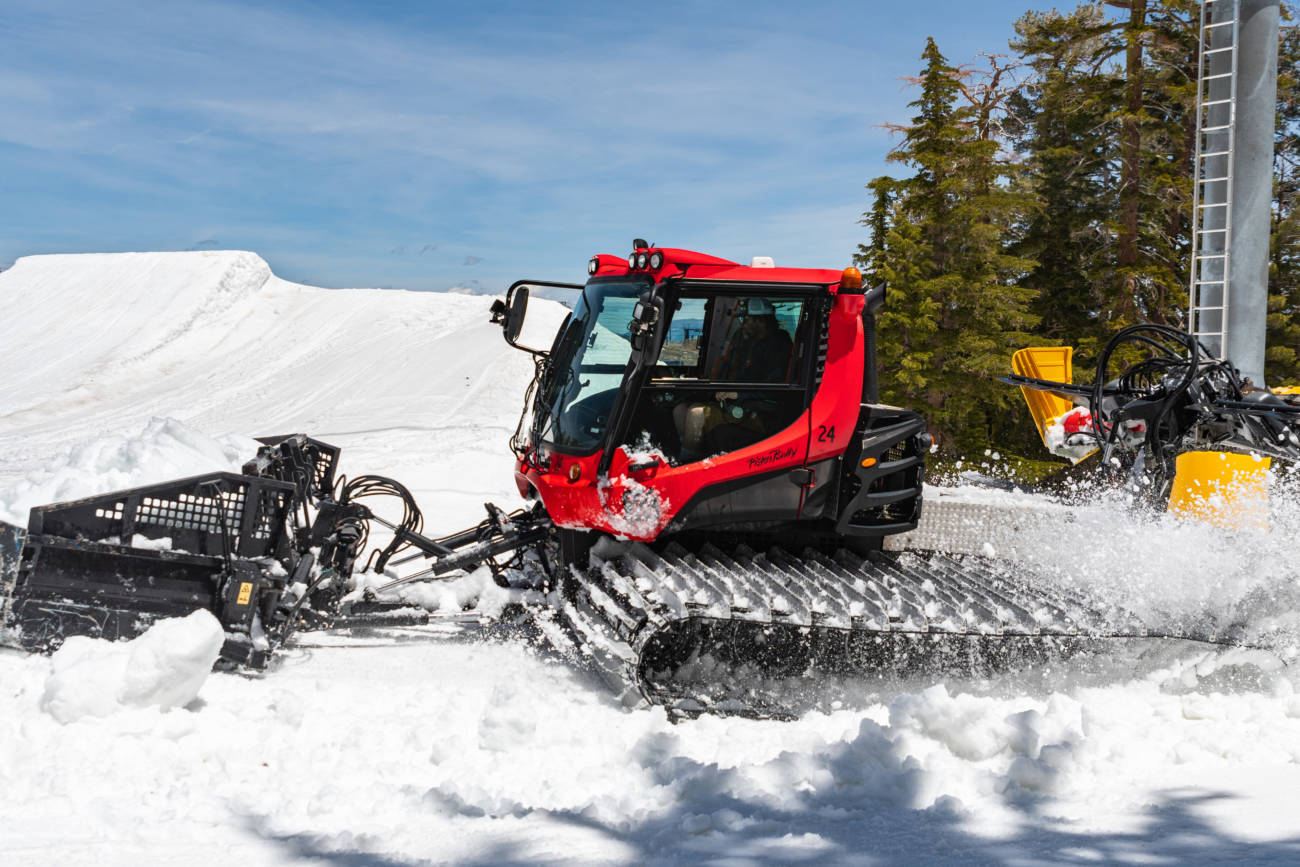 A Snowcat farms snow to keep trails covered