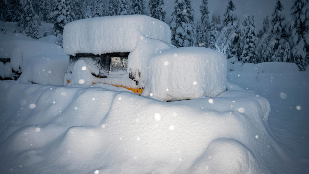 Vehicles buried in a huge December 2021 snowstorm.