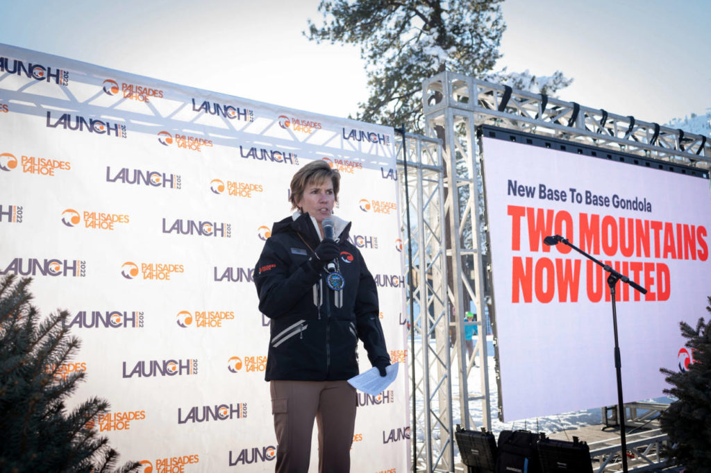 Dee Byrne, President and COO of Palisades Tahoe, giving a speech at the Base to Base Gondola Grand Opening Celebration.