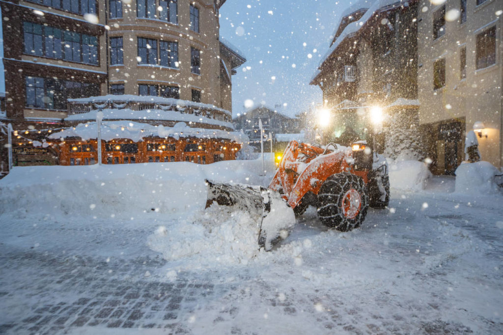 A machine moves snow during extreme Lake Tahoe weather.
