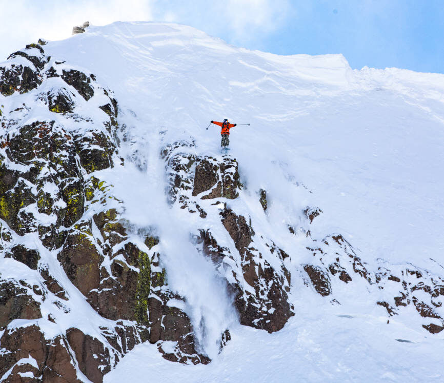 A skier with Teton Gravity Research hucks off the palisades.