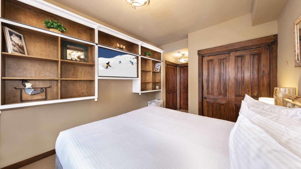 A bedroom in the Alpine Chateau Suite in The Village at Palisades Tahoe.