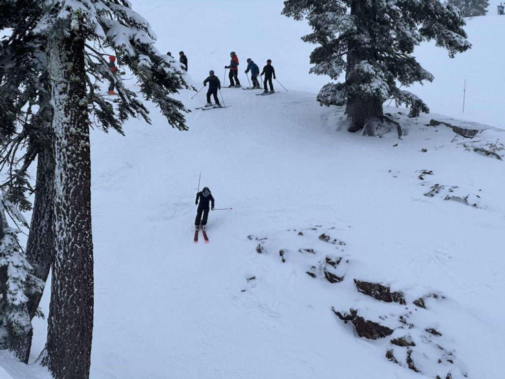 Skier enters Banana Chute at Alpine California