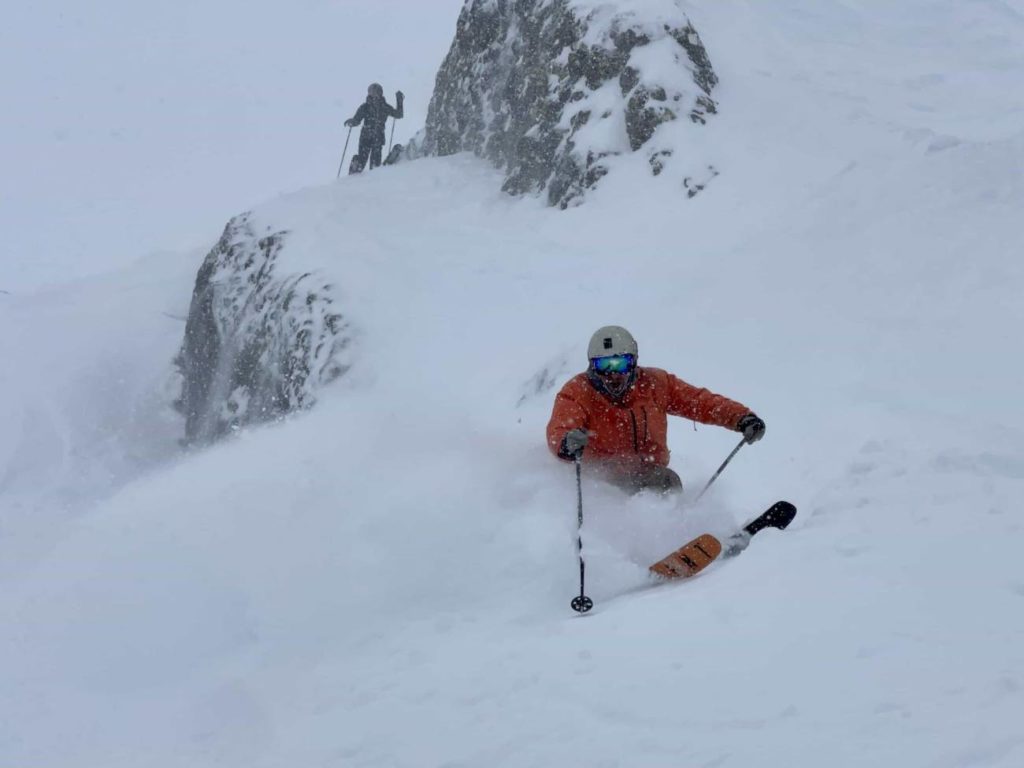 skier turning in deep snow