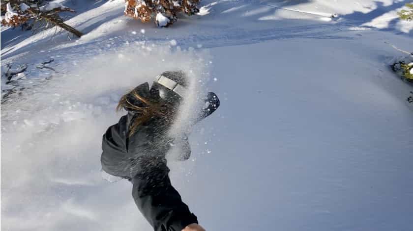 snowboarder in deep fresh powder
