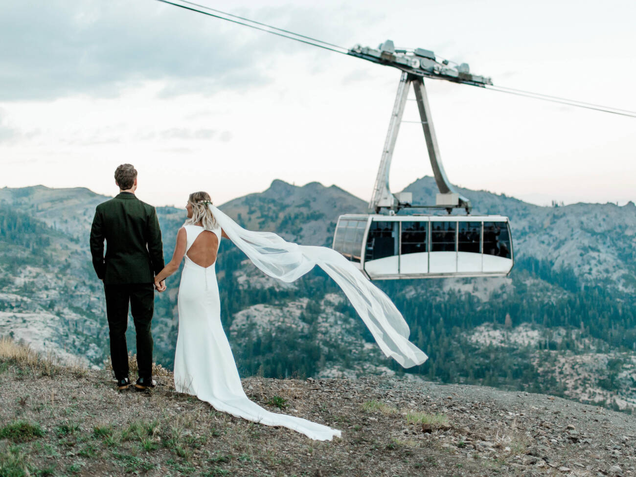 Bride and groom on looking out at the Ariel Tram at High Camp