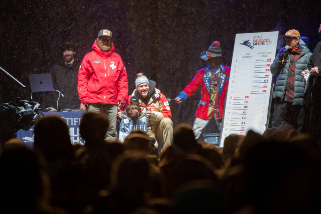 A patroller on stage for the Bib Draw for World Cup.