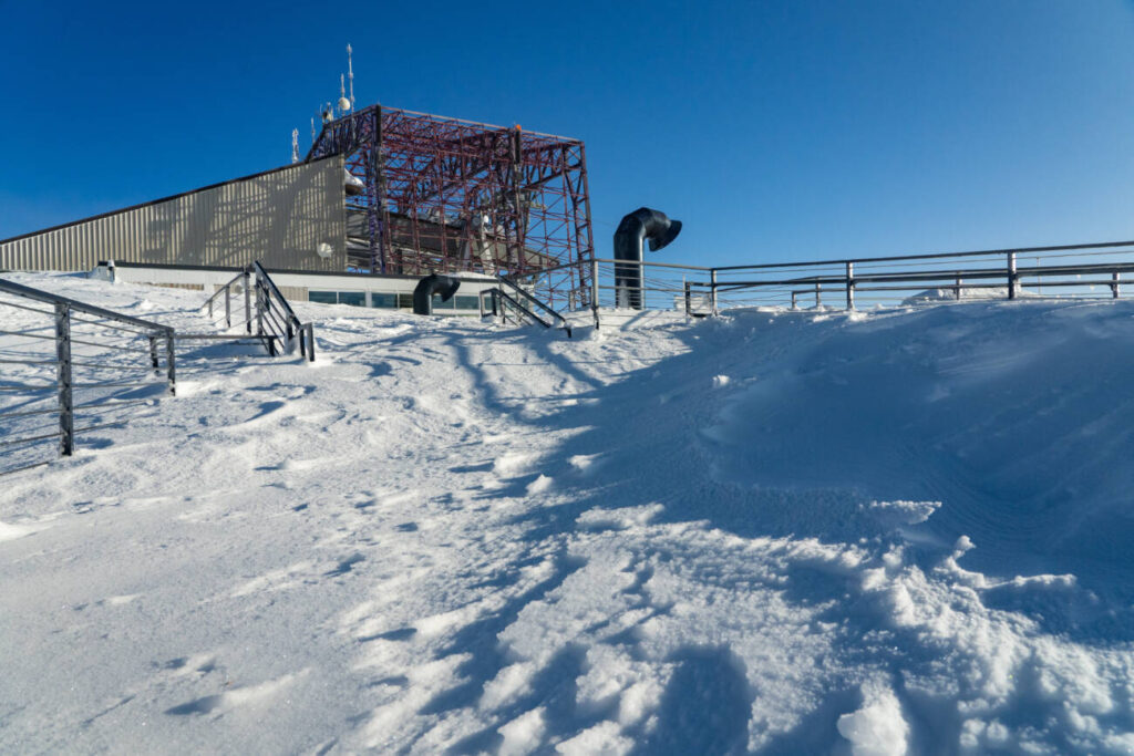 The High Camp deck completely covered in snow.