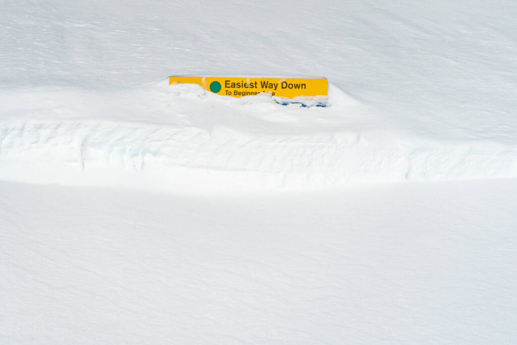 Buried signage on the upper mountain.