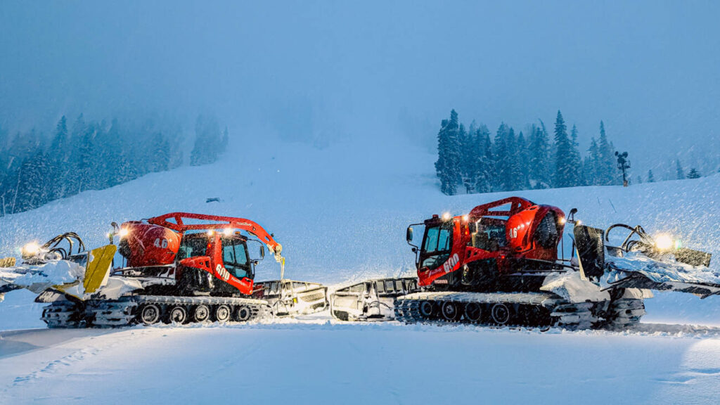 Two PistenBully snowcats in a storm at Palisades.