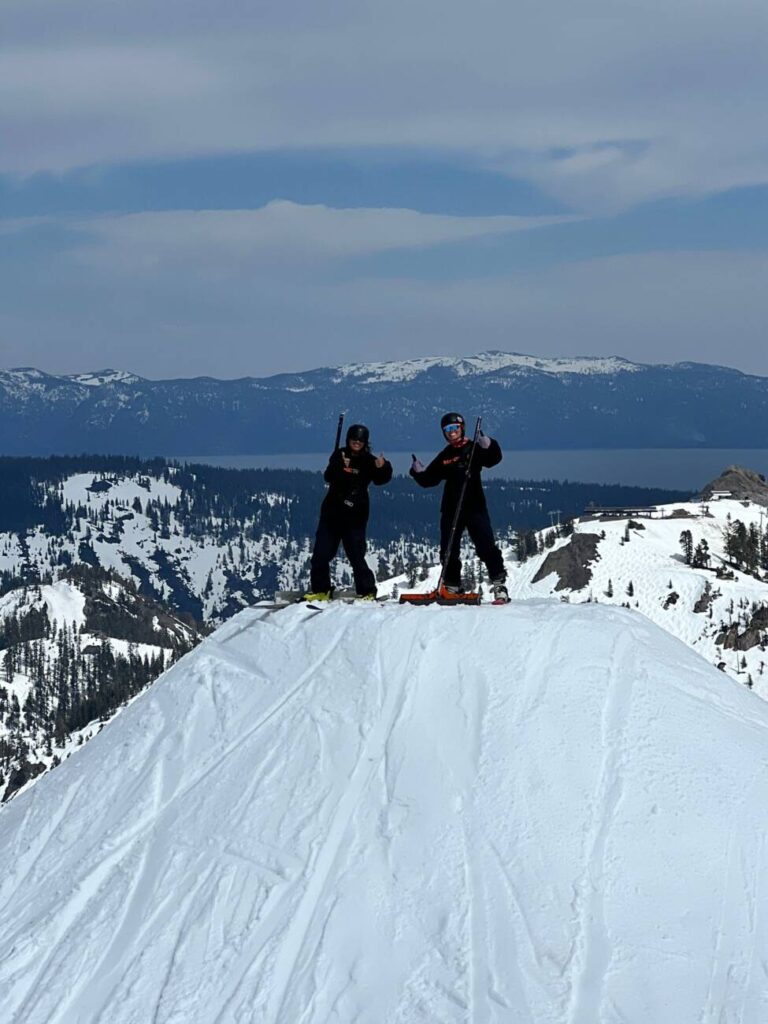Mae and Marina from Terrain Parks standing on top of a jump.