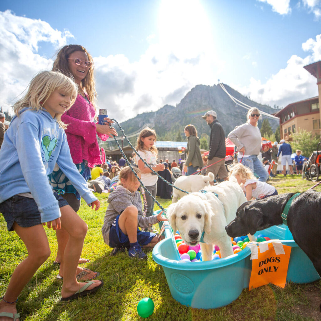 Families enjoy dog-friendly events at Palisades Tahoe. 