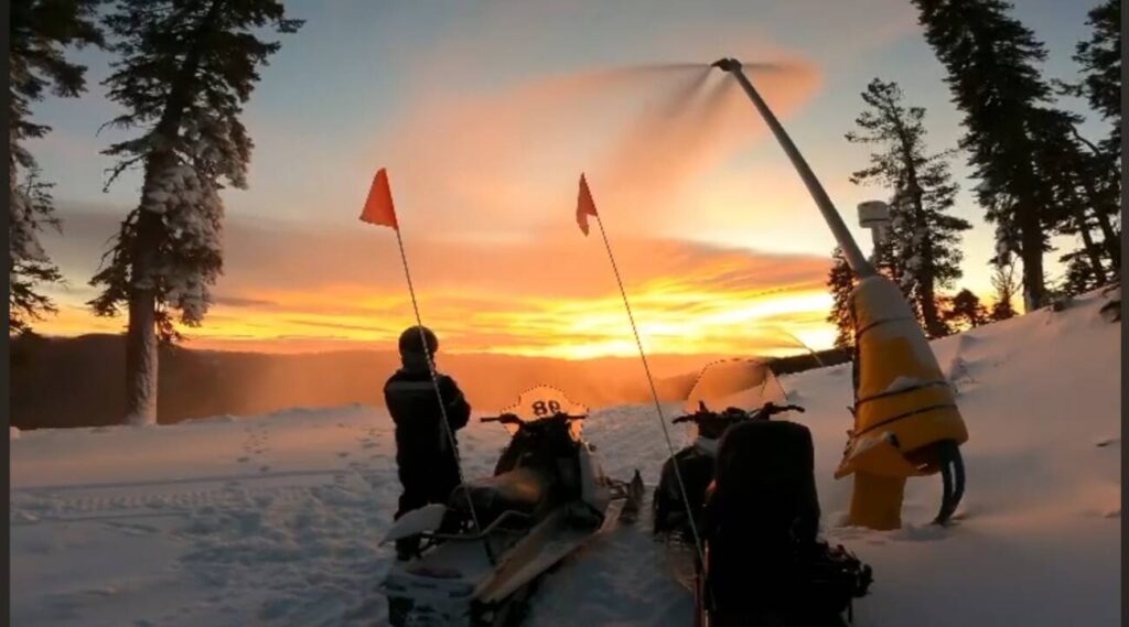 A crew out for snowmaking at sunrise