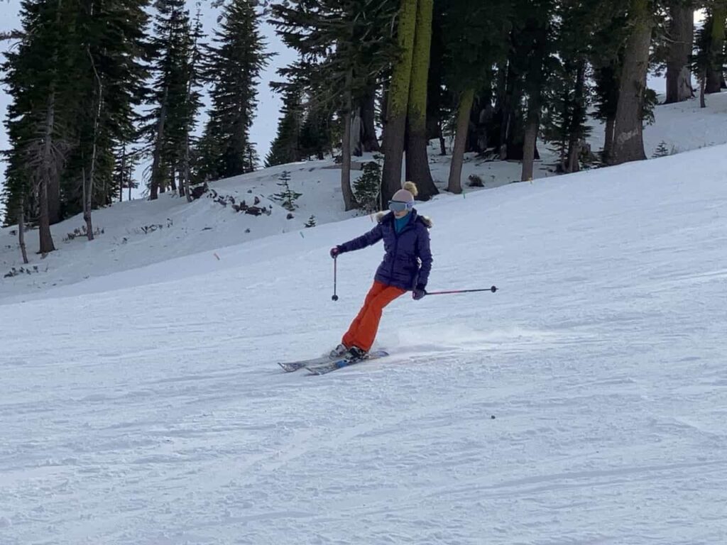 skier skiing down snowy slope