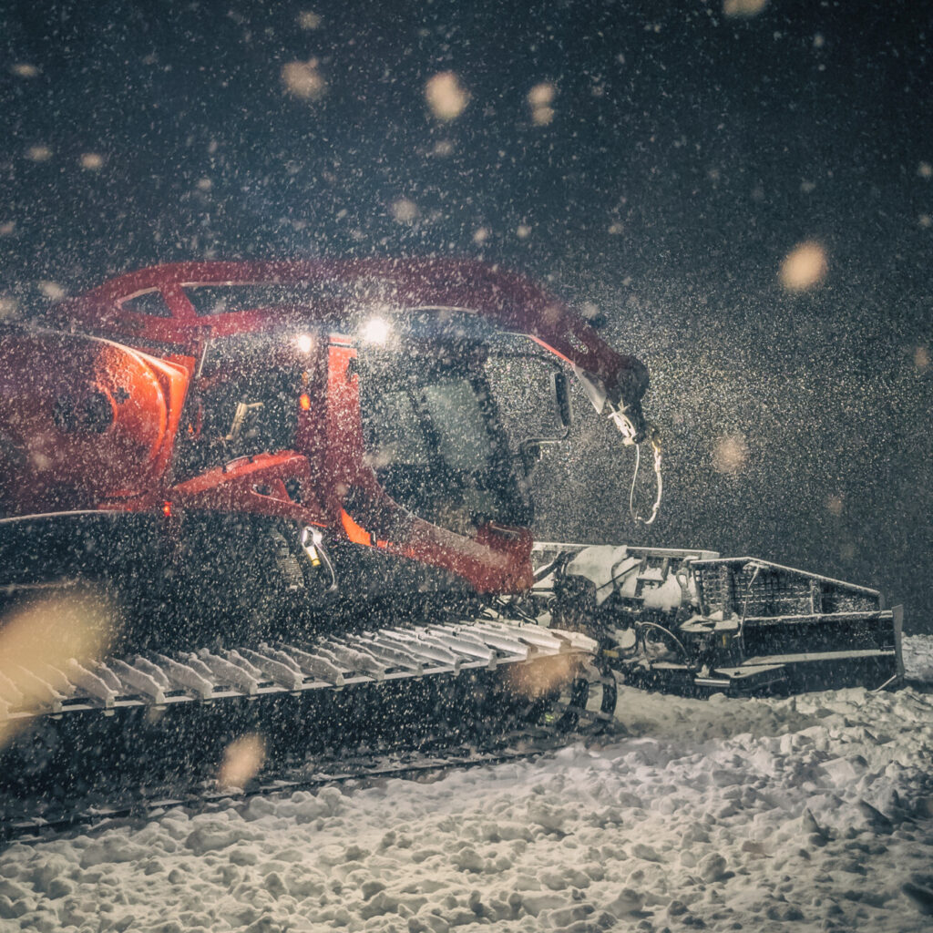 A snowcat during active heavy snowfall