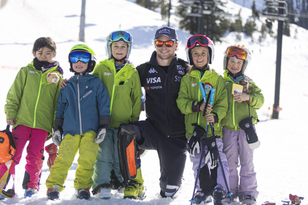Team Palisades Tahoe kids with a US Ski Team Athlete.