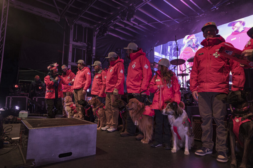 Patrol dogs on stage at the public bib draw for the Stifel Palisades Tahoe Cup.