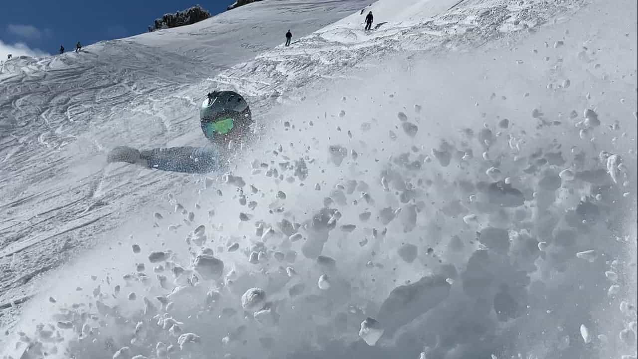 skier spraying deep powder snow