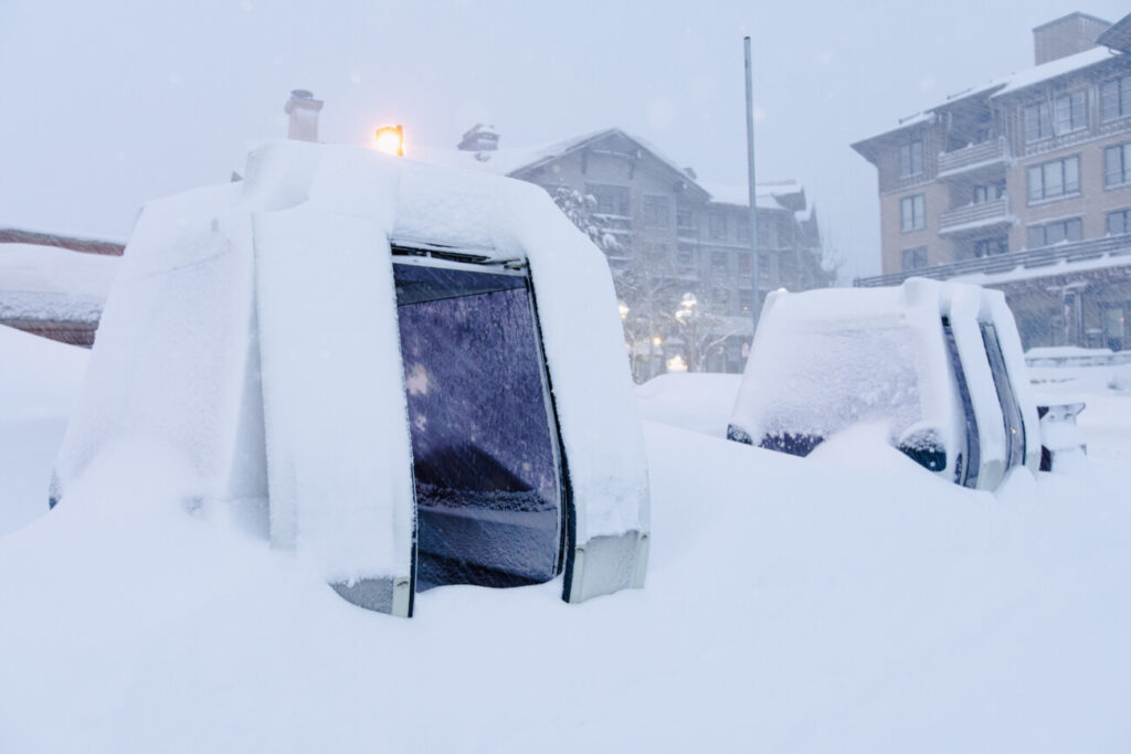 Shuttle stop cabins buried in snow.