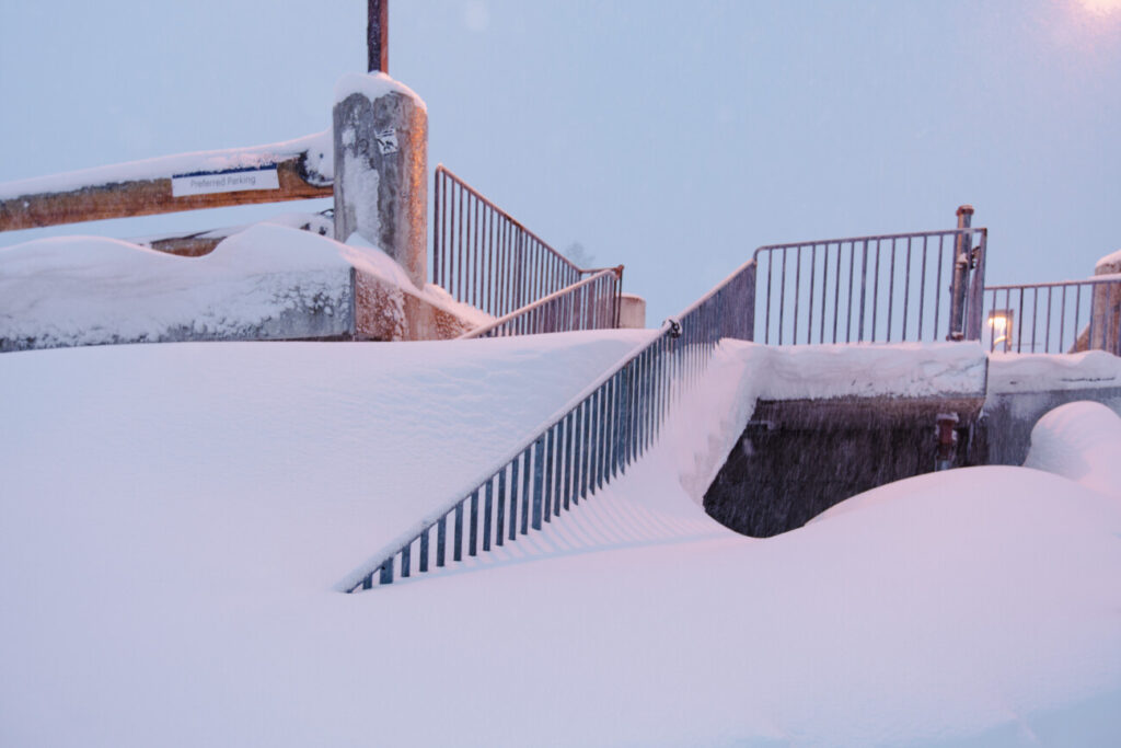 Stairs buried in The Village at Palisades Tahoe.