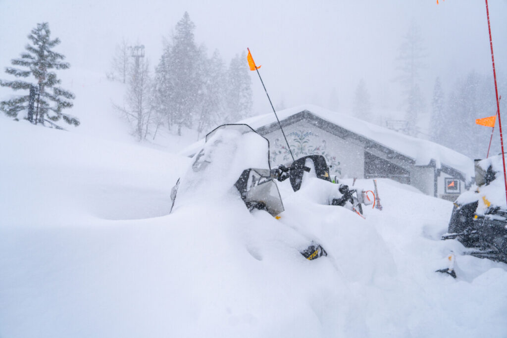 A buried snowmobile near Austria House.