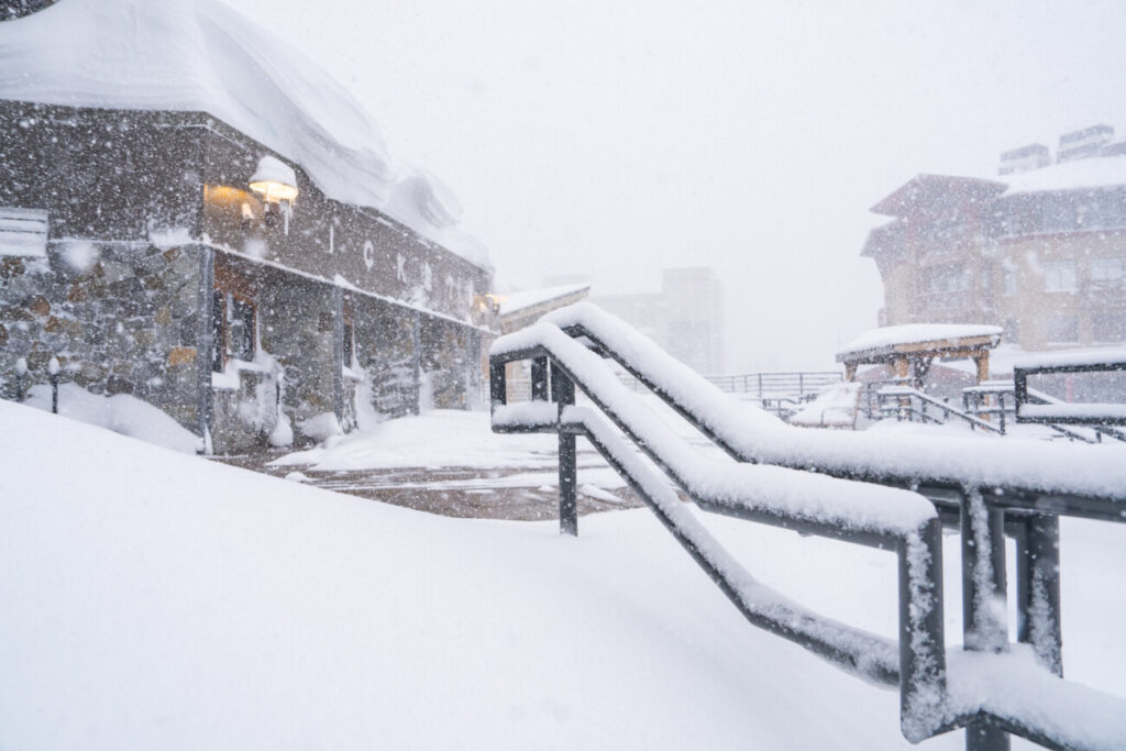 Snowfall on the steps in The Village at Palisades Tahoe.