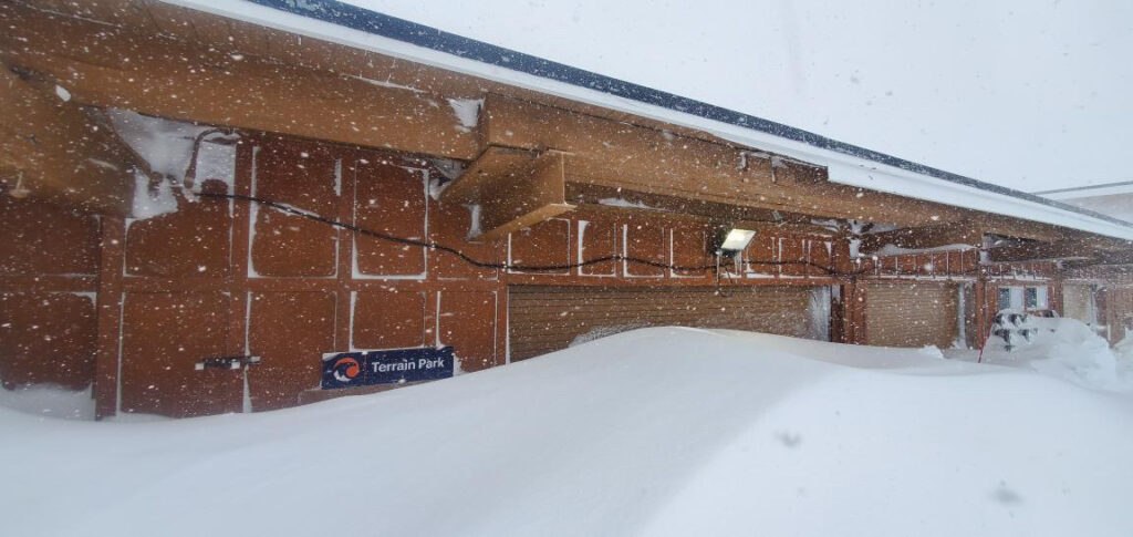 The Terrain Parks office door at Palisades, buried by a wind drift.