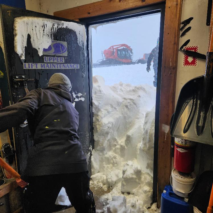 Digging out the door of the Upper Lift Maintenance shop.