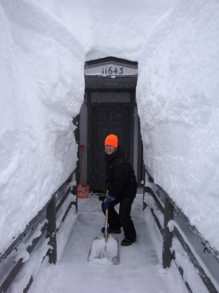 Alby shoveling fifteen feet of snow following an extreme blizzard in Tahoe Donner.