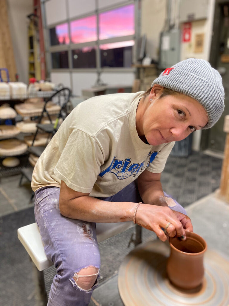 Kara Strehle, a Mountain Sports School Instructor, at the pottery wheel. 