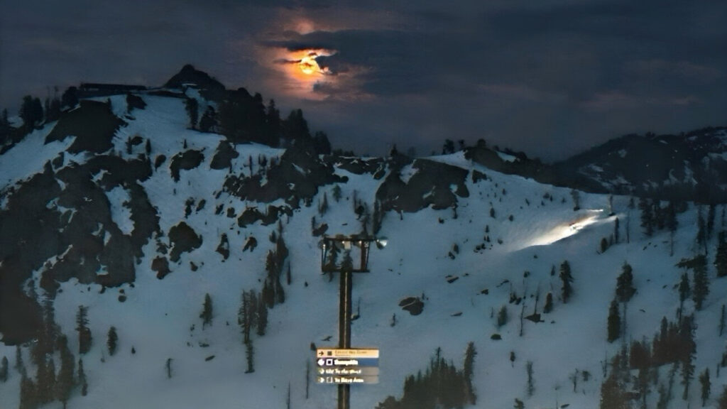 A snowcat on the Saddle under this week's Pink Moon.