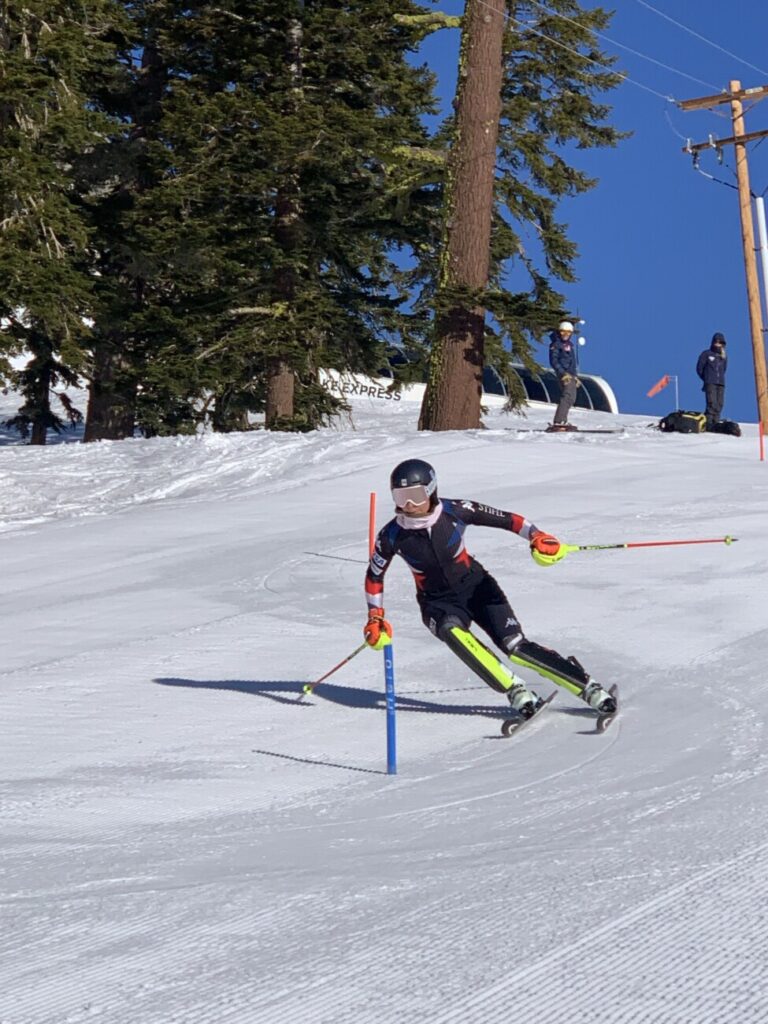 A US Ski Team athlete racing on course.