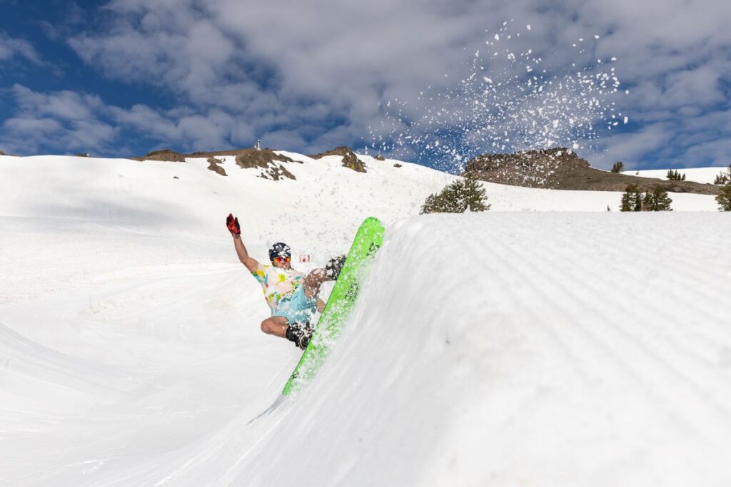 Snowboarder going up the side