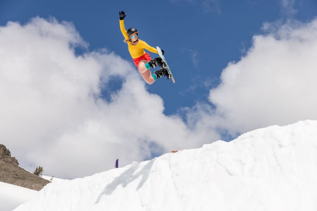 Snowboarder catching air on a jump