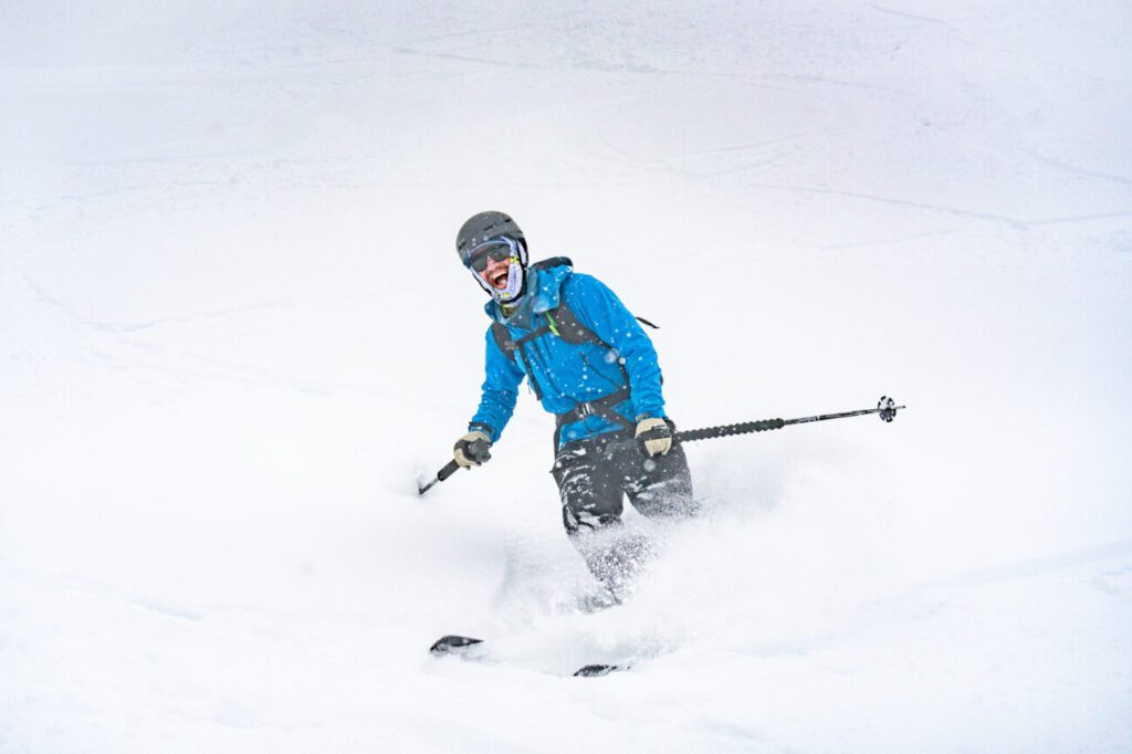 Skier ripping through powder