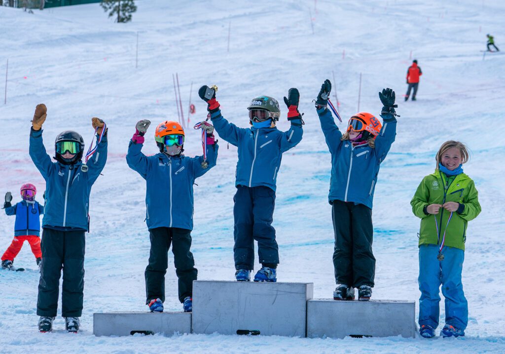 Team Palisades Tahoe kids on the podium