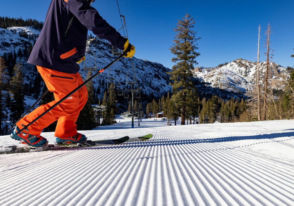 Telemark skier on fresh groomer