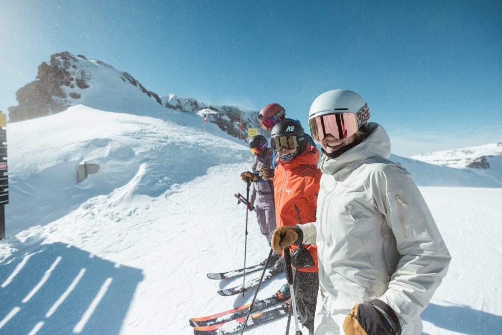 Group of skiers ready to drop in